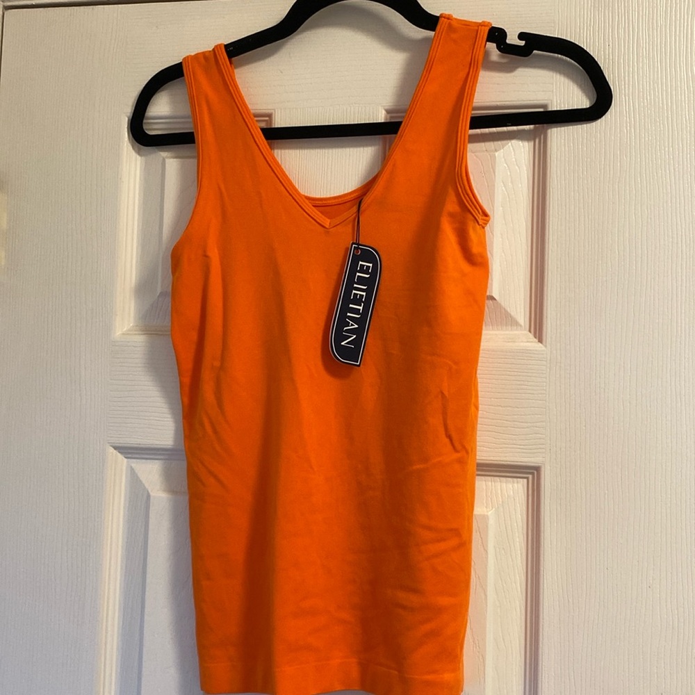Elietian looks a lot like love reversible tank in tangerine. V-neck or scoop